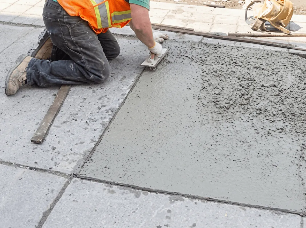 Professional repairing a concrete floor in Cape Coral, FL